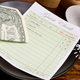 Illustration for article titled Ask The Salty Waitress: Why do I have to cash out at the end of my server’s shift?
